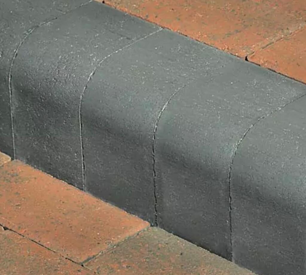Close-up detail of a driveway edging kerbs and pavers by White & Sons