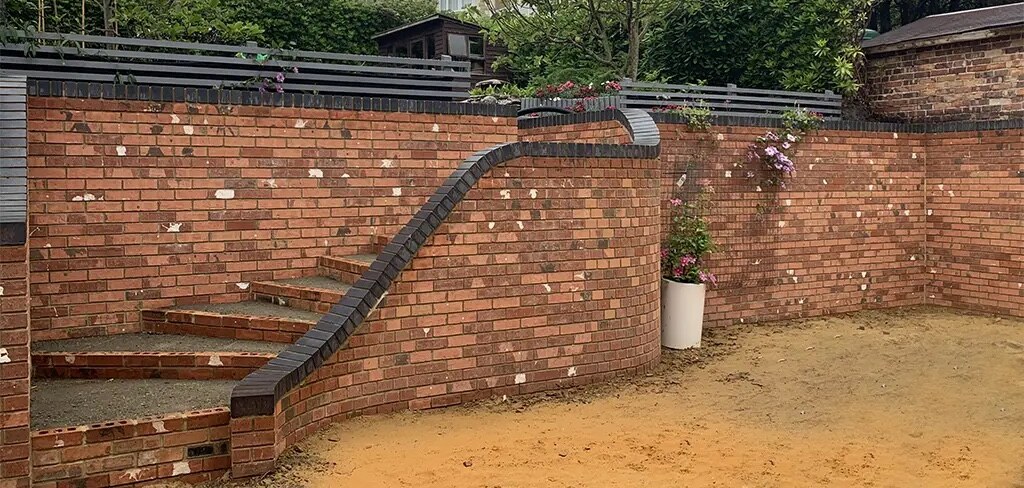 Completed structural garden wall installed by White & Sons in Dorset & Hampshire